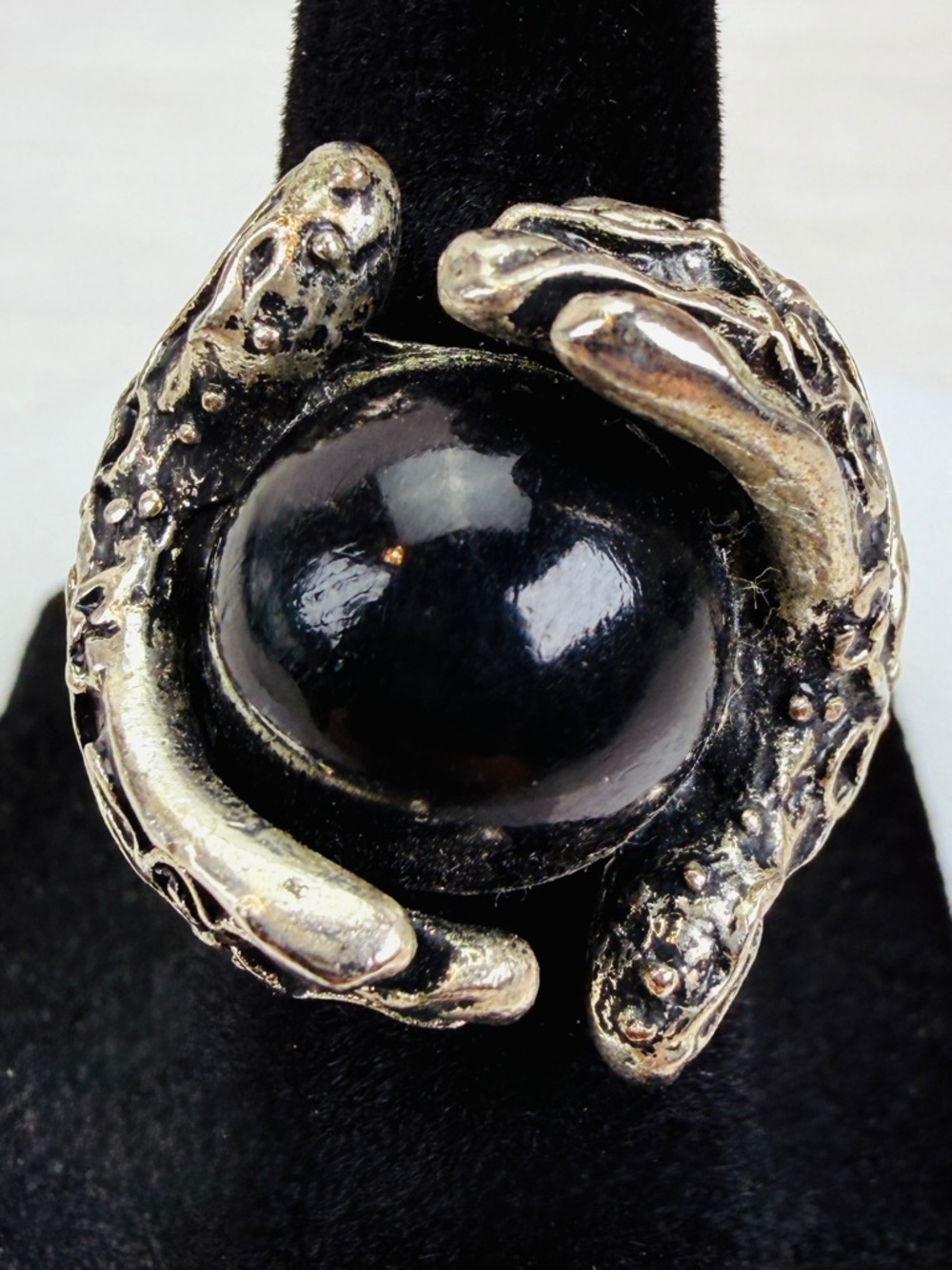 Vintage silvertone, etched hands holding black ball, size 5 ring